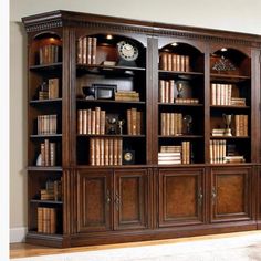 a large wooden bookcase with many books on it