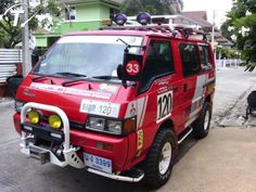 a red fire truck parked in front of a house