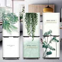 four refrigerators with plants on them in a kitchen