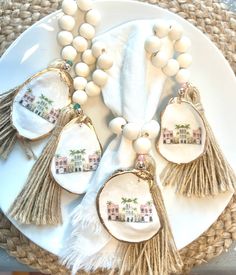 a white plate topped with tassels on top of a table