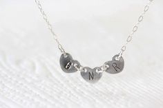 "Three shiny sterling silver hearts with personalized initials are connected by a sterling silver chain. Each heart is 7.5x6 mm, and together they make a charming heart chain. It is an ideal choice for three best friends, parents with children, or even an individual. Please include initials of your choice during Checkout in the \"message to the seller\" text box. All initials are uppercase. Choose plain or blackened initials you would like from a drop down menu. Choose length of the necklace fro Necklace Best Friends, Sisters Jewelry, Initial Heart Necklace, Three Best Friends, Sister Jewelry, Heart Chain, Monogram Necklace, Text Box, Jewelry Christmas