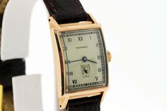 This Tavannes 14K Gold Wrist Watch has a seconds dial and is rectangular in shape for the watch case.This watch is rose gold, has a domed crystal, roman numerals, and comes with a genuine leather strap 16L Italy that is brown. This watch measures 22.87mm wide, 34.83mm tall and weighs 0.89oz.This watch is in working condition and comes with a 1 year guarantee. --Please reference our policy for more details-- International wrist watch orders will have their leather strap removed from the timepiece Gold Wrist Watch, Vintage Timepiece, Roman Numerals, Watch Case, Jaeger Watch, Time Piece, 1 Year, Wrist Watch, Leather Straps