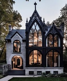 a gothic - style house with black and white architecture