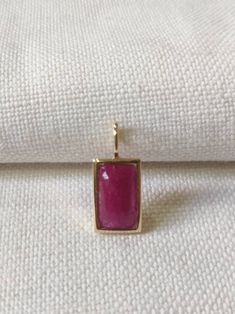 This stunning Pendant is set in 14k Solid Yellow Gold with Natural Ruby with utmost precision. It is a unique gemstone Pendant for nearly every occasion and is completely hassle-free jewelry. ITEM DETAILS: *  GEM: Ruby * GEM SIZE: 7X13mm * GEM SHAPE: Octagon * Gem weight: 3.88 carats * Gold Purity: 14KT (58.33% approx.) * Gold Weight: 1.5 gram * Total Weight of the Pendant: 2.27 gram The Gold purity is guaranteed and it comes with authentic 14KT gold hallmark. Since my items are handmade, they a Delicate Necklaces, Handmade Jewelry Box, Gold Pendants, Pendants Necklace, London Blue Topaz Ring, Ruby Pendant, Ruby Necklace, Bezel Pendant, 14k Gold Necklace