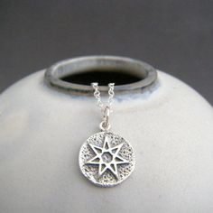 sterling silver fairy star necklace small amulet charm. faerie. tiny wiccan septagram jewelry. layering. astrology white magic pendant A fairy star amulet charm...7 points said to symbolize sun, the sea, magic, the moon, the wind, the forest, and spirit. Also can mean the 7 pillars of wisdom, 7 days of the week, 7 planets in classical view of sky. - A small solid sterling silver amulet pendant, measuring 1/2" (11 mm) across at widest point. A hearty 16 gauge (1.2 mm) thick, so sturdy yet still lightweight. - Necklace is solid sterling silver 1.5 mm cable chain, with length customizable at the drop down menu. Lobster clasp and locking jump rings, all solid sterling silver. - Small amount of blackening (oxidizing) to bring out the detail. - Polished and tumbled for great shine. - Back has a Spiritual Silver Charm Necklace With Star, Sterling Silver Star Charm Necklace, Sterling Silver Star Charm Necklace Nickel Free, Nickel-free Sterling Silver Star Charm Necklace, Silver Star Of David Spiritual Charm Necklace, Silver Star Of David Spiritual Charm Necklaces, 7 Planets, View Of Sky, Sea Magic