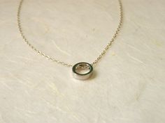 "Elegant and simple. Tiny circle charm with a delicate sterling silver chain. It is a simply beautiful piece perfect for giving to a special someone or as a gift to yourself! ♥ Circle measures 8mm ♥ Length shown on the model in the photo is 17\" Comes beautifully wrapped and ready for gift giving :) For Gold version: https://www.etsy.com/listing/264080858/delicate-circle-necklace-karma-necklace Enter Shop here: lalinne.etsy.com. Thank you so much for looking" Simple Round Pendant Charm Necklace For Anniversary, Minimalist Round Pendant Charm Necklace For Anniversary, Sterling Silver Charm Necklace Gift, Sterling Silver Circle Charm Necklace For Gift, Dainty Sterling Silver Round Pendant Charm Necklace, Silver Circle Sterling Silver Charm Necklace, Silver Circle Charm Necklace In Sterling Silver, Silver Sterling Silver Circle Charm Necklace, Sterling Silver Circle Charm Necklace With Delicate Chain