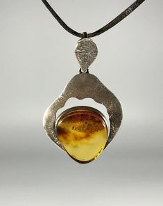 Elevate your jewelry collection with our stunning Genuine Amber Pendant, featuring a spectacular color and weighing 6,7 grams, set in high-quality 925 Sterling Silver. This exquisite pendant is designed especially for women who appreciate unique, handcrafted jewelry that combines elegance with the natural beauty of amber. Key Features: Authentic Baltic Amber: Our pendant showcases genuine Baltic amber, renowned for its stunning and unique color, adding a touch of natural elegance to any outfit. Amber Cabochon Oval Pendant Jewelry, Amber Citrine Cabochon Jewelry, Amber Sterling Silver Round Pendant Jewelry, Amber Jewelry With Large Round Pendant, Yellow Polished Round Pendant Jewelry, Antique Yellow Jewelry Collectible, Antique Yellow Pendant Jewelry, Antique Yellow Collectible Jewelry, Amber Oval Pendant Jewelry, Hallmarked