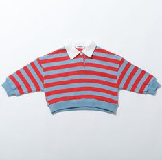 The Rascal Rugby Striped Boys Shirts combine classic prep with a touch of mischief, featuring a stylish polo collar layered underneath bold rugby stripes. Material: Organic Cotton | Colors: Red & Blue Stripe, Navy & White Stripe | Sizes: XS, S, M, L, XL, XXL Preppy Tops With Striped Polo Collar, Preppy Polo Collar Top With Striped Details, Preppy Collared Tops For College, Preppy Top With Striped Polo Collar, Red Polo Shirt With Striped Collar, Red Polo Top With Striped Collar, Classic Red Polo Shirt With Striped Collar, Red Cotton Polo Shirt With Striped Collar, Preppy Striped Polo Collar Top