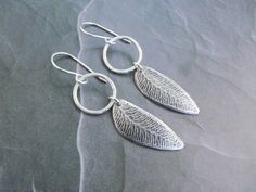 Imagine walking through the woods on a cool fall day. The leaves are crunching, the breeze gently moving your nature inspired earrings. That's the scene set with these handmade sterling silver leaf earrings. A little bit of autumn all year round. A perfect gift for any nature lover! The purchase of this listing is for one handcrafted sterling silver pair of earrings with the following specifications:  Style: Ear wire Drop Earrings Length: 1.75 inch (from bottom of ear wire) Materials: - 925 ster Silver Leaf Earrings, Earrings Nature, Dangle Earrings Silver, Womens Earrings, Earrings Fall, Earrings Leaf, Nature Inspired Jewelry, Inspired Jewelry, Metal Clay