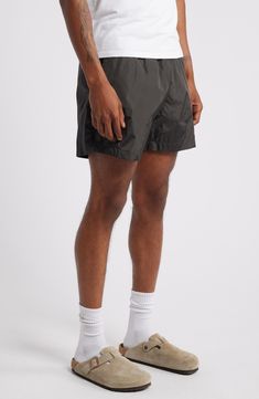 Get active and stay comfortable in these comfortably lightweight shorts ideal for the gym, sport court or a jog along the beach. Elastic/drawstring waist Front slant pockets Lined 100% ECONYL® regenerated nylon ECONYL regenerated nylon is made with recovered nylon waste, such as fishing nets and fabric scraps Machine wash, tumble dry Imported Sporty Short Length Swim Trunks With Drawstring, Sporty Swim Trunks With Drawstring, Sporty Swim Trunks With Drawstring And Short Length, Athleisure Swim Trunks With Functional Drawstring And Relaxed Fit, Sportswear Nylon Shorts With Drawstring, Sportswear Bottoms With Drawstring For Gym, Athleisure Training Shorts With Drawstring, Athleisure Bottoms With Drawstring For Training, Nylon Drawstring Sportswear Shorts