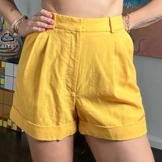 Never Worn. Excellent Condition Racil Wool Shorts. 100% Wool. Two Front Pockets. Back Faux Pockets. Zip Front. 4 Belt Loops. Waist: 26 Inch Rise: 12 Inches Inseam: 3 Inches Outer Seam: 15 Inches Yellow Summer Shorts For Work, Chic Yellow Shorts For Workwear, Yellow Workwear Bottoms Shorts, Yellow Short Bottoms For Work, Yellow Short Length Bottoms For Workwear, Yellow Short Length Workwear Bottoms, Yellow Shorts For Workwear In Spring, Yellow Shorts For Spring Workwear, Yellow Workwear Shorts For Spring