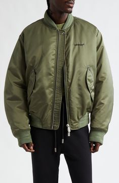 An olive-green hue underscores the military-inspired aesthetic of this nylon bomber jacket embroidered with the label's Bookish logo and signature arrows. Two-way front-zip closure Blade collar Ribbed cuffs Front zip pockets Ribbed hem Lined, with polyester fill 100% polyamide Spot clean Made in Italy Designer Clothing Black Owned/Founded Green Embroidered Logo Outerwear For Streetwear, Off-white Logo, Inspired Aesthetic, Clothing Black, Military Inspired, Four Leaf, Leaf Clover, Four Leaf Clover, Logo Embroidered