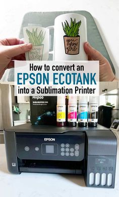 two hands holding up an epson ecotank printer