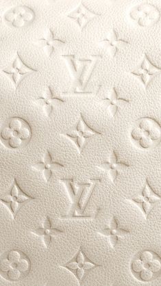 an upholstered mattress with white letters and monograms on the bottom side