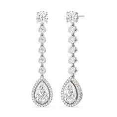 The teardrop-shaped diamonds are the centerpiece of these earrings. Their graceful shape adds movement and flow to the design, creating a captivating and elegant look. Luxury Pear-shaped Chandelier Earrings For Formal Events, Pear-shaped Diamond Earrings For Evening, Timeless Pear-shaped Diamond Earrings For Formal Occasions, Elegant Pear-shaped Diamond Earrings For Evening, Formal Teardrop Chandelier Earrings With Diamond Accents, Teardrop Chandelier Earrings With Diamond Accents For Formal Occasions, Formal Pear-shaped Diamond Bridal Earrings, Luxury Teardrop Chandelier Earrings With Diamond Accents, Elegant Pear-shaped Chandelier Earrings For Formal Occasions