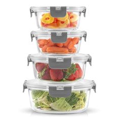 four plastic containers stacked on top of each other filled with fruit and veggies