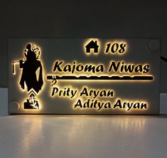 the name plate is lit up with leds and features an image of a woman holding a cane