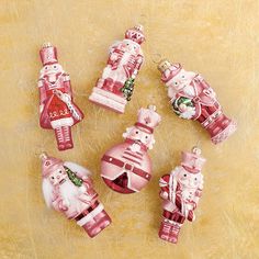 christmas ornaments are arranged in the shape of santa and mrs claus