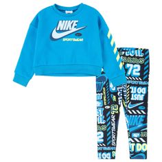 Upgrade your toddlers’ athleisure with the sporty and stylish Nike Crew & Legging Set. The lightweight fleece top offers a super soft and fuzzy feel, while the soft cotton-blend pants deliver a comfortable fit. The batwing sleeves with elastic cuffs bring in a statement touch, and the allover gradient print decked up with a Nike graphic on the front reps the brand. Let your little girls toddle with flair in the super-comfortable and versatile Nike Crew & Legging Set. Nike Crew & Legging Set feat Blue Sportswear Sweats For Fall, Sporty Graphic Print Sets For Sports, Sporty Graphic Print Sports Sets, Blue Activewear With Letter Print For Sports, Blue Letter Print Activewear For Sports, Blue Sporty Activewear With Letter Print, Blue Sporty Sets For Streetwear, Fall Sports Sets Sportswear, Blue Sporty Streetwear Sets