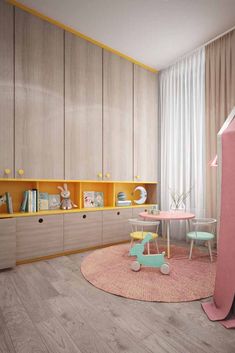 a child's room with pink and yellow furniture