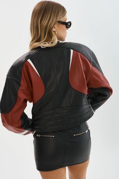 Level up your style game with the Dustin Leather Racer Jacket. This statement piece boasts a cropped length, contrasting colors, and a silhouette that's right on trend. Crafted from high-quality leather, it pairs perfectly with jeans or the matching micro mini. Cool and edgy, the Dustin is the ultimate addition to the model-off-duty wardrobe. Trendy Black Leather Cropped Jacket, Sporty Leather Biker Jacket, Black Leather Long Sleeve Cropped Jacket, Black Leather Cropped Jacket With Long Sleeves, Edgy Black Leather Cropped Jacket, Black Leather Biker Jacket With Contrast Stitching, Sporty Leather Jacket With Long Sleeves, Black Leather Cropped Jacket, Leather Racer Jacket