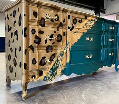 an old dresser has been painted with leopard spots