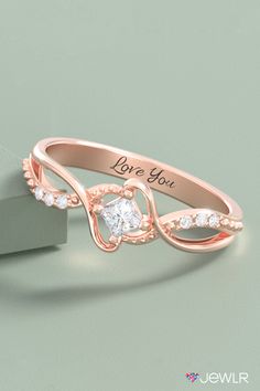 This beautiful birthstone promise ring features a customizable, princess-cut solitaire gemstone and six accent stones. Create yours in silver, yellow, white, or rose gold, and add an engraving for a special touch. This personalized promise ring makes a beautiful birthstone jewelry gift, the perfect girlfriend gift, or a romantic gift for her. #Jewlr #PromiseRing #PersonalizedJewelry #BirthstoneRing #RoseGold #Rings Promise Princess Cut Birthstone Ring, Fine Jewelry Cubic Zirconia Princess Cut Birthstone Ring, Cubic Zirconia Princess Cut Birthstone Ring, Anniversary Rings With Princess Cut Side Stones, Anniversary Princess Cut Rings With Side Stones, Princess Cut Rings With Side Stones For Anniversary, Asscher Cut Diamond Birthstone Ring For Anniversary, Elegant Diamond Ring With Side Stones As Gift, Princess Cut Diamond Ring With Accent Stones For Promise