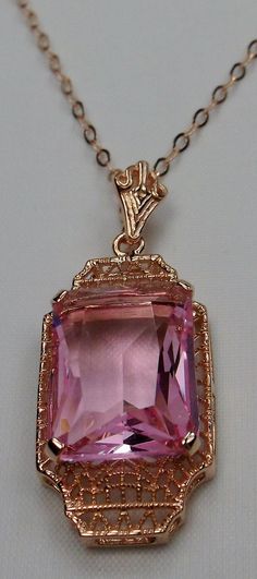 "Simulated Pink Topaz Pendant Lantern Design#P13 Custom Made This is a lovely Art Deco reproduction of a brooch that I fell in love with. Fashioned in the design of the brooch, I now offer this lovely Antique reproduction pendant in rose gold plated sterling silver (matching 18ct earrings also available for sale). The flawless simulated 9ct Pink Topaz is 15mm long (just over 9/16\") and 12mm in width (1/2th\"). The pendant is 1 3/8th inches long, it is 9/16th\" wide. The bail opening is 3.5mm wi Vintage Rose Gold Jewelry With Intricate Design, Vintage Rose Gold Filigree Necklaces, Vintage Rose Gold Filigree Necklace, Antique Pink Jewelry For Formal Occasions, Formal Antique Pink Jewelry, Vintage Rose Gold Jewelry With Diamond Cut, Vintage Rose Gold Diamond Cut Jewelry, Classic Rose Gold Filigree Jewelry, Rose Gold Vintage Jewelry For Evening