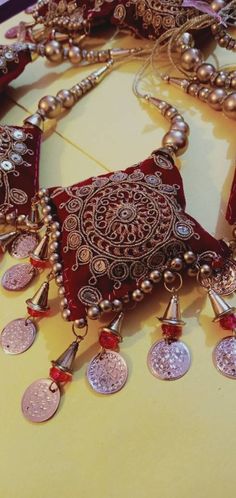 Luxury Jewelry With Latkans For Rituals, Luxury Latkans Jewelry For Navratri, Traditional Red Jewelry With Tassels, Festive Bohemian Jewelry With Handwork, Festive Red Tasseled Jewelry, Traditional Tassel Necklace For Festival, Gold Tassel Necklace For Festivals, Handmade Traditional Tassel Necklace Gift, Cloth Tassels