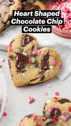 chocolate chip cookies with pink and white sprinkles in the shape of heart