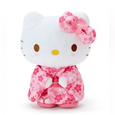 a hello kitty stuffed animal with a pink bow on it's head, sitting in front of a white background