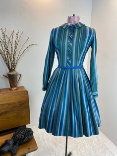 "1960's Blue And Green Stripe Shirt Dress This is such a great shirt dress. The stripes and the careful placement of them make this shirt dress next level attractive. Just check out the pictures and see how the stripes were perfectly utilized to make a regular cut shirt dress into something special. This dress is a button front closure, has her makers tag, which is frayed. Maker is Carol Rodgers Juniors Measurements provided are flat and have been doubled. Bust 34\" Waist 25\" Hips free\" Length Vintage Striped Dress, 60s Cocktail Dress, Stripe Shirt Dress, Heart Blouse, Cut Shirt, 1960's Dress, Striped Shirt Dress, Special Dresses, 60s Dress