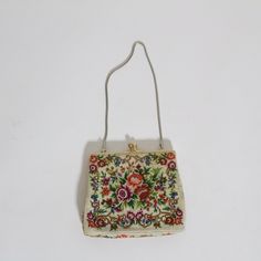 This purse would make such a unique gift! There are so many colors in it that it's sure to go with nearly any outfit While the purse metal claps/detailing is gold, the chain is silver Purse: 5.5 x 5 inches Silver Purse, The Chain, Small Purse, Unique Gifts, Purse, Chain, Silver, Gold, Gifts