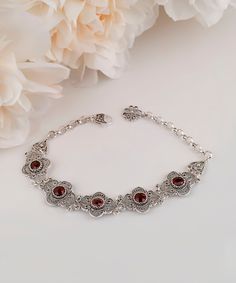 "Genuine Garnet 925 Sterling Silver Handmade Artisan Crafted Filigree Adjustable Station Bracelet 7\" + 2\" Extender Women Jewelry Gifts Boxed for Her Material: 925 Solid Sterling Silver Bracelet Length: 7 inches + 2 inches Extender (Total wearable length: 9 inches) Bracelet Width: 0.60 inches Genuine Garnet Gemstones: 6 mm round, Approximate Total Carat Weight: 5.80 Comes with a gift pouch and box Free Domestic Shipping It is a gift that will create memories for years to come. Our fine silver j Classic Sterling Silver Filigree Bracelet Gift, Classic Sterling Silver Bracelet With Intricate Design As Gift, Ornate Adjustable Bracelets As Gifts, Classic Sterling Silver Bracelet With Intricate Design, Traditional Decorative Bracelets As Gift, Traditional Decorative Bracelets For Gifts, Classic Bracelets With Intricate Design For Gift, Bohemian Filigree Bracelets As A Gift, Ornate Adjustable Sterling Silver Bracelet Gift