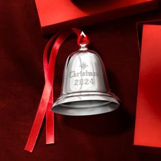 Lenox - Reed & Barton 2024 Silver Annual Christmas Bell Ornament - 40th Edition. From Reed & Barton, this 2024 sterling silver annual Christmas bell ornament is a classic addition to your treasured holiday collection. Engraved with "Christmas 2024" and features a festive red ribbon. Beautifully handcrafted by skilled silversmiths in the USA. Measures 2 3/4"H. Item(s) are safely and securely packaged. Sterling Christmas Ornaments, Christmas Bell, Bell Ornaments, Fine Jewelery, Christmas 2024, Christmas Bells, Red Ribbon, Holiday Collection, 4 H