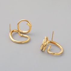 Our coating and high polish add secret ingredient to the rings for your contemporary & chic outfit. Abstract geometric earrings that will never go out of style, this jewelry piece is simple enough to accessorize easily but creative enough to make your look stand out. This pair of 18K gold statement earrings that compliments any outfit, easily create stylish look in Parisian, Minimalist, Bohemian, or even Punk. • S P E C I F I C A T I O N • Finish: 18K multi-layered gold plating on titanium steel Dimension: approx. 22 cm x 24mm For ring of this style please visit here. Modern Gold Plated Earrings With Ear Wire, Minimalist Gold-plated Circle Earrings, Modern Gold Round Wrap Earrings, Minimalist Gold Plated Circle Earrings, Modern Round Gold Plated Earrings, Modern Gold Hoop Plug Earrings, Minimalist Metal Hoop Ear Cuff, Modern Gold Plated Plug Earrings As Gift, Modern Gold-plated Plug Earrings As Gift