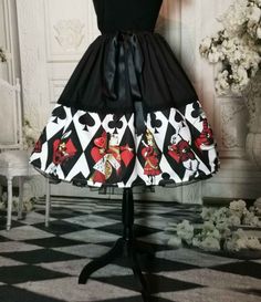 Are you off to a Mad Hatter's Tea party?  Then this may be the perfect skirt for you.    Featuring the Queen of Hearts, Queen Alice, The White Rabbit and other delightful characters from the Lewis Carroll classic all in wonderful vibrant red, black and white.  I've designed this iconic Alice in Wonderland fabric and then created this full 50's style skirt with fun in mind. LIKE THIS FABRIC?  Find all my Alice in Wonderland fabric designs in the Victorian and Steampunk store on Spoonflower.com  - https://www.spoonflower.com/profiles/victorianandsteampunk (check out the Alice in Wonderland collection) NEED A MATCHING TOP HAT?  Find the DIY Print at home matching Mini Top Hat here https://www.etsy.com/au/listing/1296467550 BOOTS - https://www.etsy.com/au/listing/1111363074 Sneakers - https:// Alice In Wonderland Queen, Wonderland Queen Of Hearts, Wonderland Clothes, Queen Alice, Alice Costume, Alice Cosplay, The Queen Of Hearts, Alice In Wonderland Costume, Wonderland Costumes