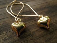 Sweet and beautiful Heart Earrings, Dangle Gold Heart, what a perfect gift! So sweet and simple! Romantic, Simple Vintage Style Puffed 14k Gold Filled Heart Pendant (approx. 0.9 cm / 0.3 inch), dangle from my hand crafted 14K Gold filled earrings. Length of earrings: 1.5 inch / 4 cm approximately I create each piece of jewelry for you with love and emphasis on every detail, choosing each bead and stone, quality and my special giving to you:) All items are gift-packed. By virtue of being hand-mad Simple Vintage Style, Gold Heart Earrings, Gold Heart Earring, Valentines Sale, Wedding Sale, Valentines Day Gifts For Her, Gold Filled Earrings, Beautiful Heart, Gold Heart