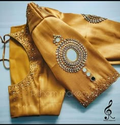 Here Are The Latest Designs For Bridal Blouses With Maggam Work. The Maggam Work With Kundan, Thread And Spring Can Be Customised Along With The Cloth Color You Want To Choose. Having These Kind Of Maggam Work Blouses Is Very Trendy For Traditional Gatherings And Poojas. This Enhances The Beauty Of Any Saree When This Is Teamed Up With Different Kind Of Maggam Designs. The Combination Of Aari And Zardosi Works Make This Maggam Designs Look Very Elegant And Beautiful. We Customize The Blouse As P Aari Work Saree, Blouse Maggam Work, Mirror Work Blouse Design, Latest Bridal Blouse Designs, Maggam Work Blouse, Latest Blouse Designs Pattern, Sari Design, Latest Model Blouse Designs, Traditional Blouse Designs