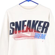 Description:Vintage Age 18-20 white Nike sweatshirt, fits x-large.GENDER: boys CONDITION: good - lettering fading.STYLE: sweatshirtERA: 1990sCOLOUR: whiteFABRIC: cotton blend White Logo Print Sweatshirt For Streetwear, Throwback Cotton Sweatshirt With Graphic Print, Throwback Long Sleeve Letter Print T-shirt, 90s Crew Sweatshirt With Logo Print, White Urban Sweatshirt With Letter Print, White Throwback Sweatshirt With Letter Print, White Throwback Sweatshirt With Graphic Print, Vintage White Crew Sweatshirt, White Graphic Design T-shirt