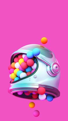 an image of a helmet with balls coming out of it on a bright pink background