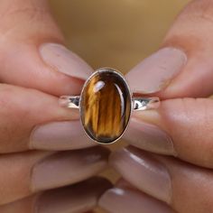 "Tiger Eye Ring, 925 Sterling Silver Ring, Oval Shaped Ring, Gemstone Ring, Stone Ring, Handmade Ring, Statement Ring, Boho Ring, Women Ring Gemstone Name - Tiger Eye Stone Quality - AAA Ring Weight - 3.88 gm Stone Shape - As shown in the picture * You Will Get The Same Product As Shown In The Picture. We serve complete 925 sterling silver Jewelry and genuine properties of the stone. The products are dispatched from the small business from USA. Product Quality and Packaging - Our all products ar Tiger Eye Ring, Ring Crystal, Natural Gemstone Ring, Rose Quartz Ring, Tigers Eye Gemstone, Jewelry Statement, Eye Ring, Handmade Rings, Ring Oval