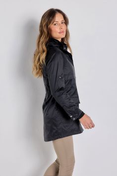 The stylish, sporty jacket that just happens to be wind-resistant, the Ramona is the one you'll want to pack for every trip. A longer-length style that weighs almost nothing and has lots of functional details like adjustable sleeve tabs and a removable hood (handy in unpredictable weather). It's the lightweight layer that everyone should have in their carry-on bag. Relaxed fit with adjustable cinched waist High collar Long sleeves with button cuffs and tabs for adjustable sleeve length Detachabl Black Outerwear With Storm Flap For Fall, Casual Black Outerwear For Commuting, Winter Travel Outerwear With Storm Flap, Fall Windproof Functional Sport Coat, Black Nylon Sport Coat For Fall, Functional Windproof Sport Coat For Fall, Black Windproof Outerwear For Travel, Black Windproof Travel Outerwear, Fitted Black Travel Outerwear