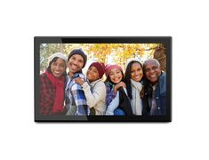 a group of people standing next to each other in front of a white wall with a black frame