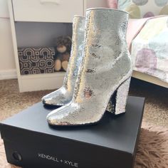 Beautiful Kendall + Kylie Ankle Silver Sequins Booties . These Booths Have A Block Heel Of Aprox. 4 Inches Tall. Total Heigh Including The Heel Is 9 1/2 Inches. They Zip Up And Have A Rounded Toe Shape. Great To Pair With Denim, Shorts, Dresses, Dress Pants ! They Are Brand New And Come With Their Original Box . Spring Party Booties With Block Heel, Trendy Party Booties With Block Heel, Fitted Booties With Block Heel For Party, Spring Party Booties With Medium Width, Party Booties For Spring, Medium Width, Spring Party Booties Medium Width, Medium Width Round Toe Booties For Party, Sock Ankle Boots, Studded Boots