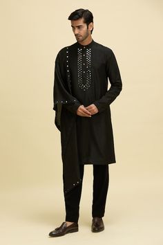 Black kurta with mirror embroidery along the placket. Paired with a pant. - Aza Fashions Ceremonial Cotton Silk Kurta With Traditional Drape, Black Sherwani With Chikankari Embroidery, Black Cotton Silk Designer Sets, Black Chikankari Embroidered Sherwani, Black Chikankari Embroidery Sherwani, Festive Black Bandhgala With Chikankari Embroidery, Cotton Sherwani With Mirror Work And Traditional Drape, Black Chanderi Churidar With Embroidered Border, Traditional Cotton Sherwani With Mirror Work