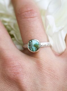 ⮚⮚ About The Design ⮘⮘ This sterling memorial ring design is a sweet celebration of contrasts! A bold 8mm Tibetan turquoise cab meets a petite 3mm comfort band featuring a vintage floral motif. This playful contrast creates the perfect setup for stacking your favorite bands. The example ring shown is in our signature brushed satin finish but can be polished to a high shine or even given an antique patina application for no additional cost. Your beloved's ashes are held within our specially handcrafted urn setting. After the ashes are placed and your choice of turquoise cab is set, your memorial is lovingly gift-wrapped for its journey back to you.  ⮚⮚ Sending Ashes for Your Cremation Jewelry ⮘⮘ Shortly after you complete your purchase, you will receive a .PDF guide with detailed instructio Artisan Turquoise Jewelry For Anniversary, Unique Turquoise Jewelry For Anniversary, One Of A Kind Turquoise Jewelry For Anniversary, Turquoise Round Jewelry For May Birthstone, Stackable Sterling Silver Turquoise Ring For Wedding, Sterling Silver Stackable Turquoise Ring For Wedding, Wedding Stackable Turquoise Ring In Sterling Silver, Artisan Turquoise Round Ring For Anniversary, Turquoise Ring With Bezel Setting