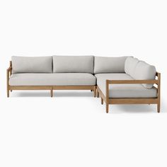 an image of a couch and footstool set on a white background with no one in it