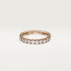 a rose gold wedding band with five diamonds