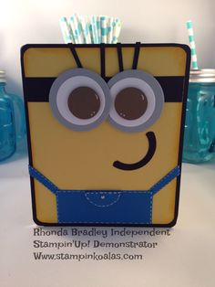 a card made to look like a minion with paper straws sticking out of it